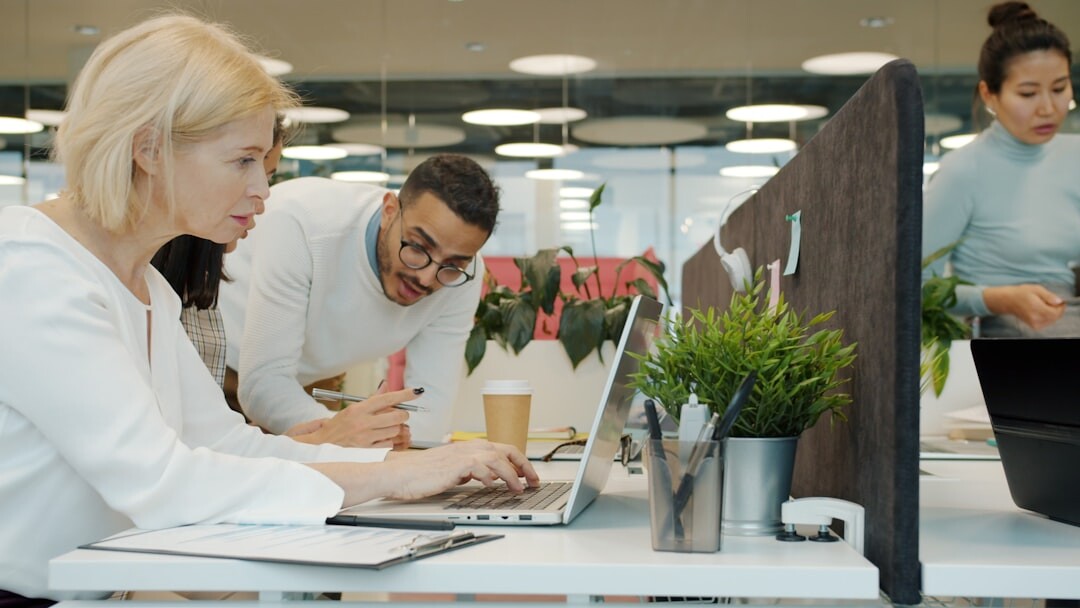 Diverse team of professionals working together in a modern office
